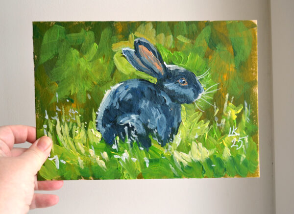 One-of-a-kind acrylic painting "Black Rabbit in Sunlit Grass" by Lada Kholosho (2025). Perfect for wildlife art lovers and collectors. Ships worldwide.