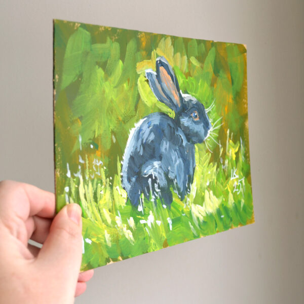 One-of-a-kind acrylic painting "Black Rabbit in Sunlit Grass" by Lada Kholosho (2025). Perfect for wildlife art lovers and collectors. Ships worldwide.
