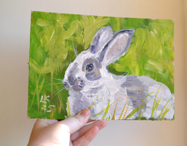 One-of-a-kind acrylic painting "White bunny portrait" by Lada Kholosho (2025). Charming and vibrant artwork featuring a rabbit in lush green foliage. Perfect for wildlife art lovers and collectors. Ships worldwide