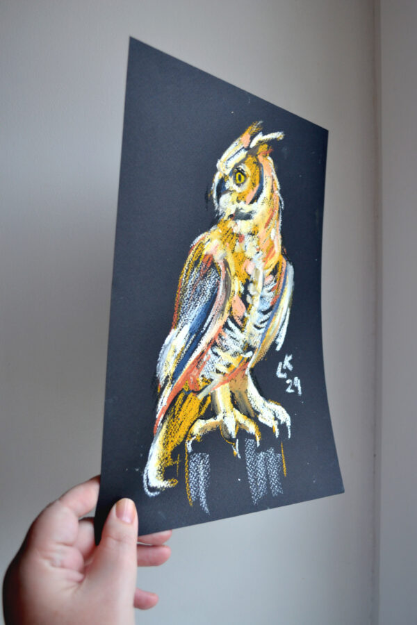 Original oil pastel painting "Great Horned Owl in Profile" by Lada Kholosho – bold wildlife art showcasing a majestic owl with vibrant colors against a deep black background.