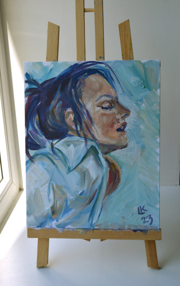 Serene oil painting by Lada Kholosho: a tranquil portrait capturing a moment of introspection. Soft blue tones, expressive brushstrokes. One-of-a-kind artwork.